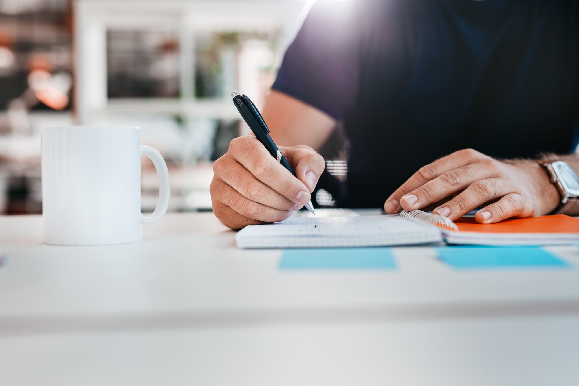 Businessman hands writing notes