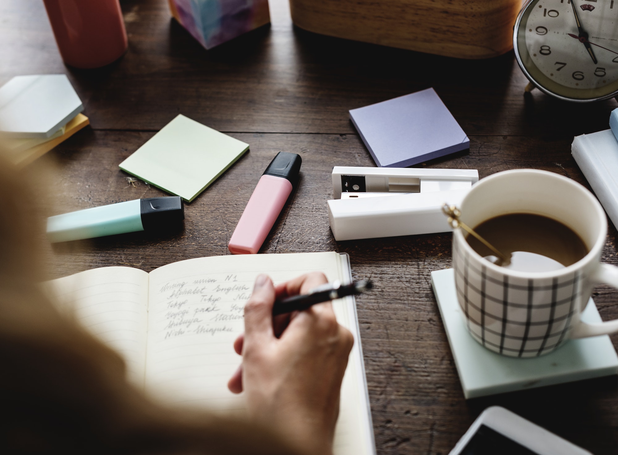 Caucasian woman writing a note