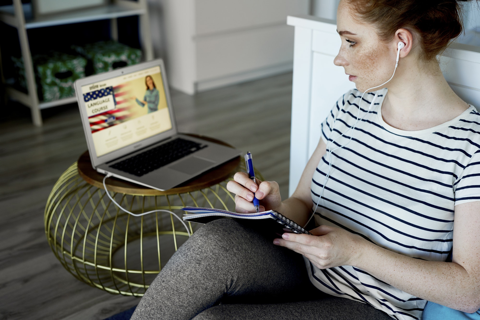 Young woman taking some language lesson online