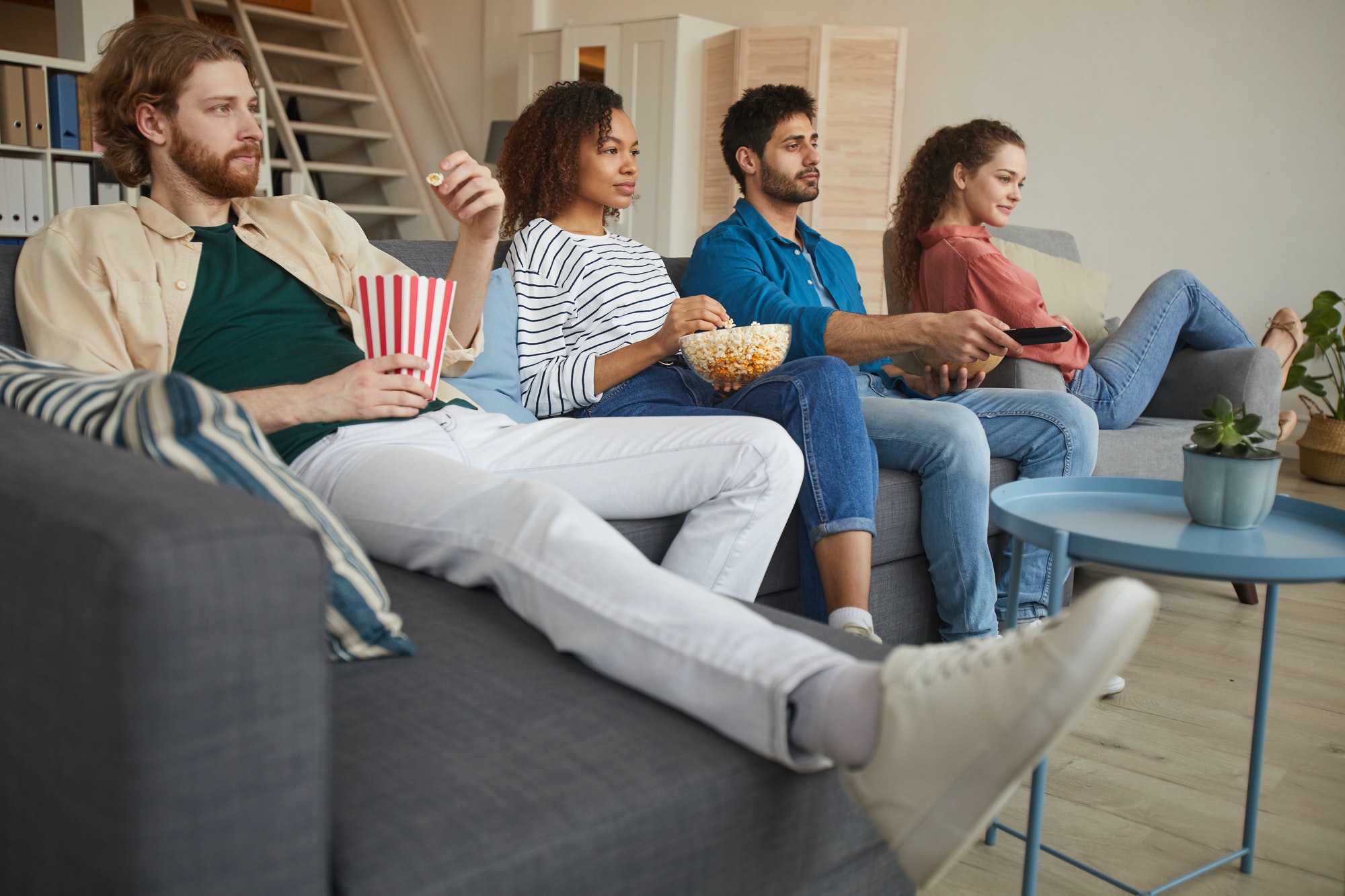 Multi Ethnic Group of Friends Watching Movies at Home